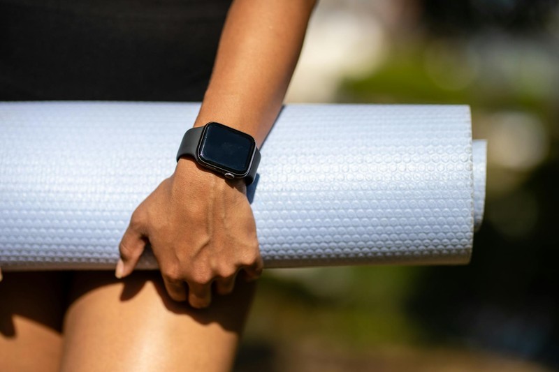 Smartwatch with yoga mat — ready for a training session