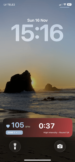 iPhone lock screen showing Live Activity with workout metrics